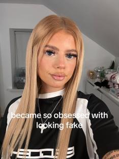 Woman with blonde hair and makeup, wearing a black shirt, and a necklace. Text overlay reads: