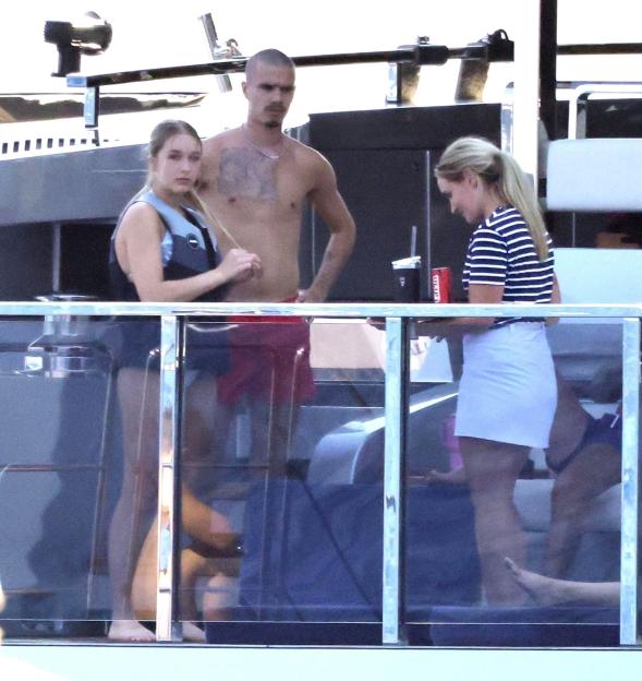 Romeo Beckham and his girlfriend on a yacht.