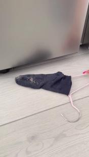 Sock filled with dust used to clean hard-to-reach places.