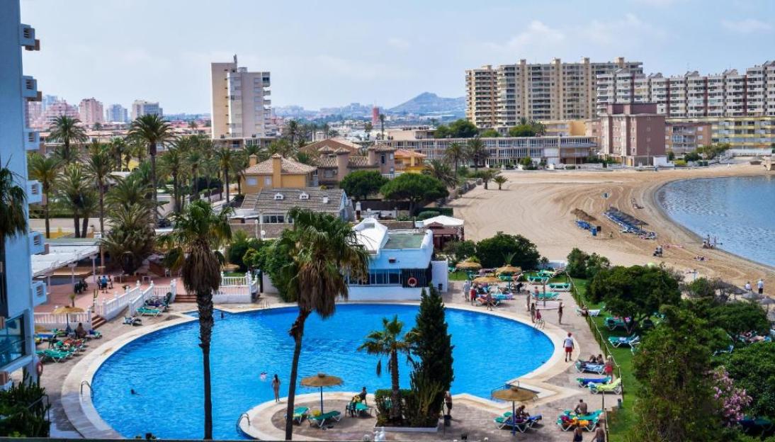 Hotel pool and beach view.