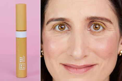 An image collage containing 2 images, Image 1 shows Yellow mascara tube on pink background, Image 2 shows Portrait of Claire Coleman, beauty writer, wearing a white t-shirt and gold jewelry