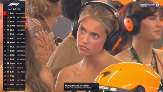 Margarida Corceiro wearing headphones at a Formula 1 race.