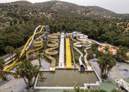 Inside world’s ‘grimmest’ abandoned water park where moss-covered slides left to rot for a decade after tragic death