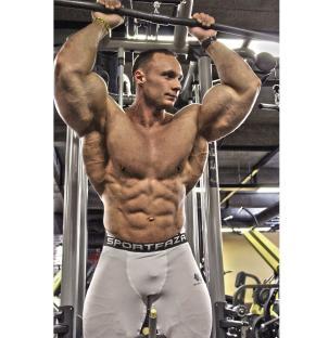 Bodybuilder Nikita Tkachuk working out.