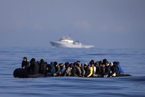 Migrants in an inflatable boat crossing the English Channel.
