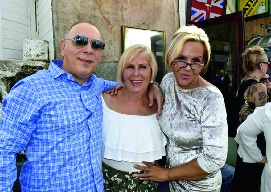 Three people posing for a photo.