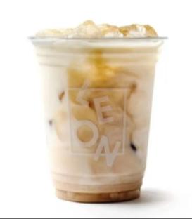 LEON iced chai latte in a clear plastic cup with ice.