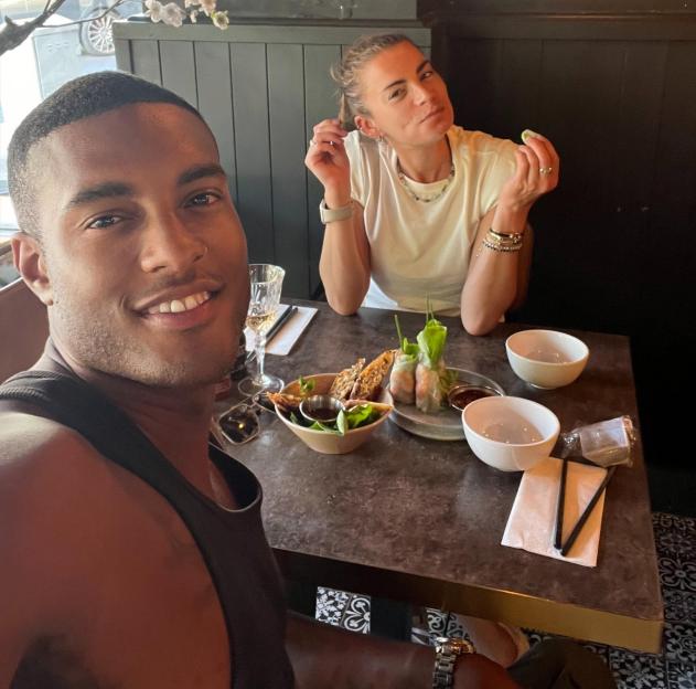 Couple enjoying a meal together at a restaurant.