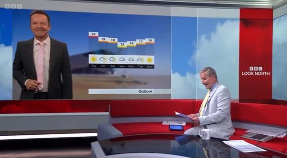 Two BBC Look North presenters on set, one reading a weather forecast.