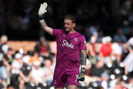 Jordan Pickford of Everton waving to fans after a soccer game.