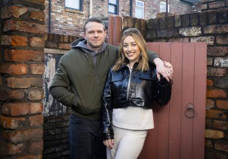 Gemma and Mick, new Coronation Street characters, stand together.
