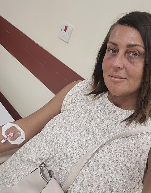 Woman receiving chemotherapy.