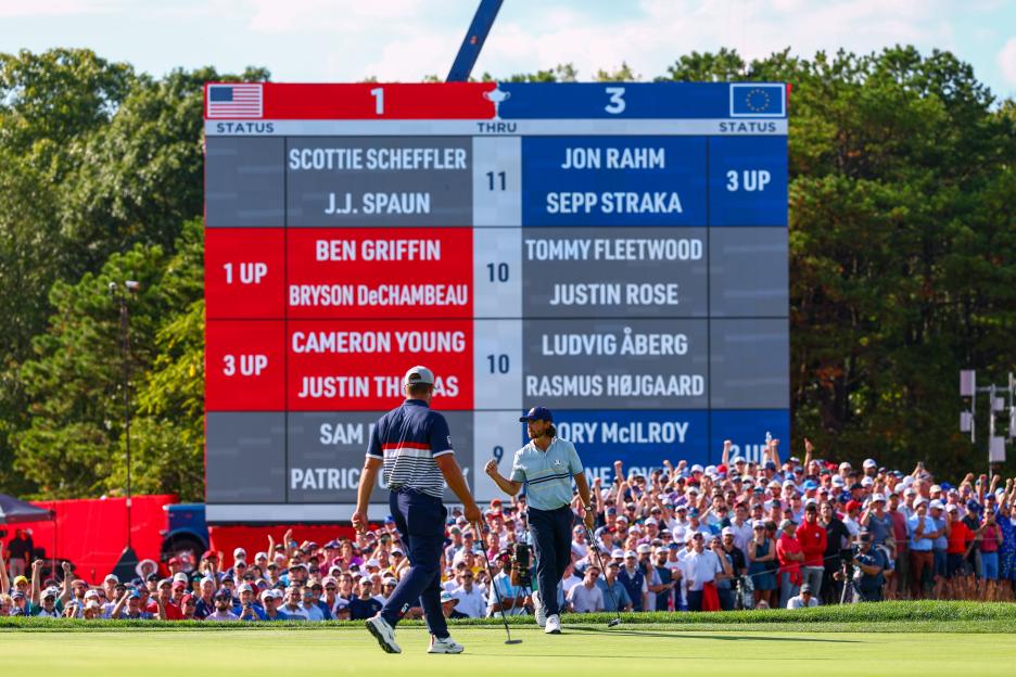 Tommy Fleetwood of Team Europe in front of the Ryder Cup scoreboard.