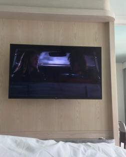 A television showing a scene from a movie.