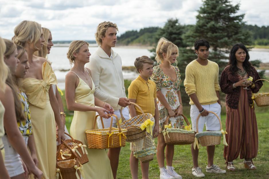 Candice King, Caitlin FitzGerald, Mamie Gummer, Joseph Zada, Esther McGregor, and Shubham Maheshwari stand outdoors holding baskets.