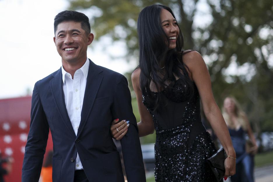Collin Morikawa and his wife Katherine Morikawa smiling.