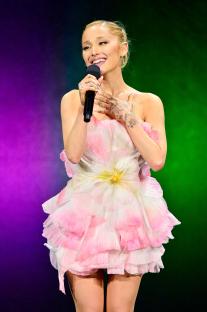 Ariana Grande speaking onstage at CinemaCon.