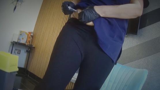 Person self-administering an injection.