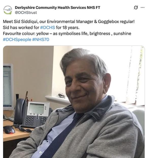 Sid Siddiqui sitting at a desk with a phone and monitor in the background.