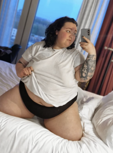 Selfie of Beckie Bold in a white t-shirt and black underwear.