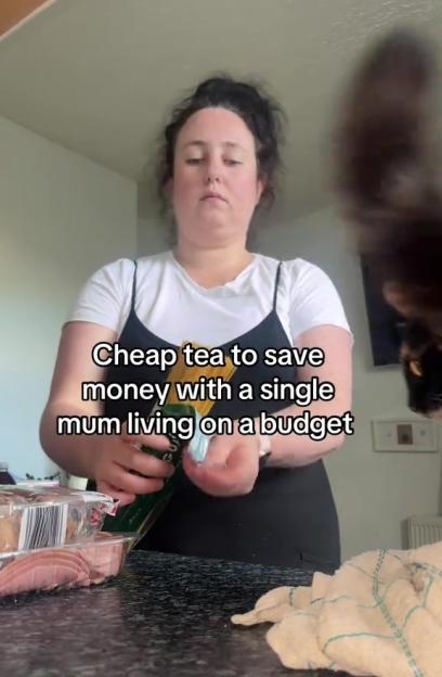 Single mother preparing a budget-friendly meal.