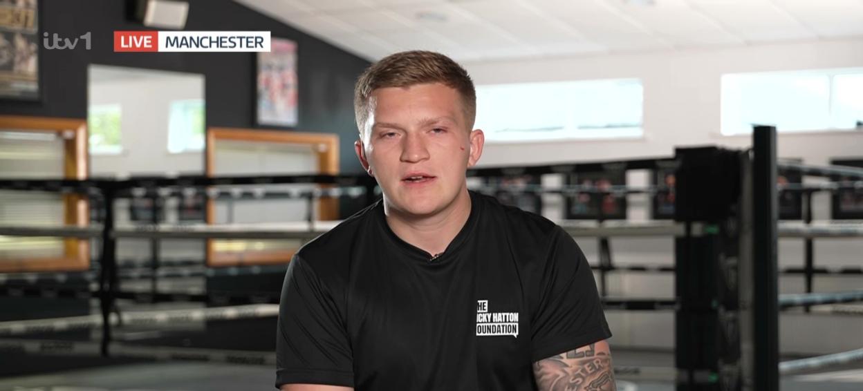A young man in a black t-shirt speaking on ITV1's Good Morning Britain about The Ricky Hatton Foundation.