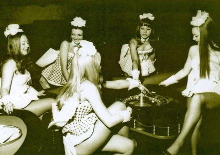 Illustration of women in gingham dresses operating a roulette wheel.