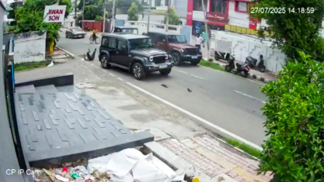 Security camera footage of a car hitting a pedestrian.