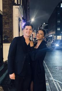 Danny O’Donoghue and his fiancée, Anais Naing, posing for a photo at night.
