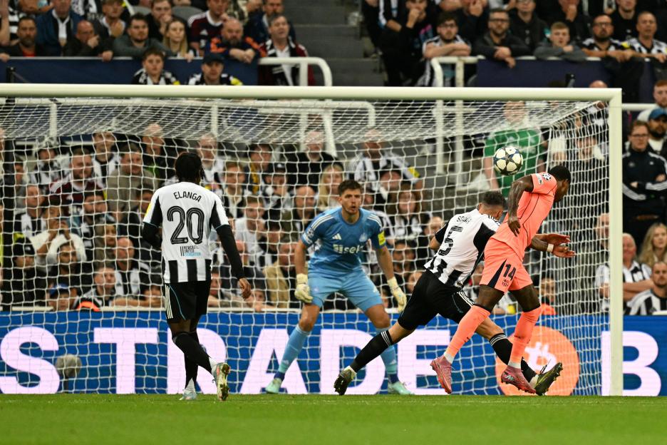 Marcus Rashford heading the ball to score a goal.
