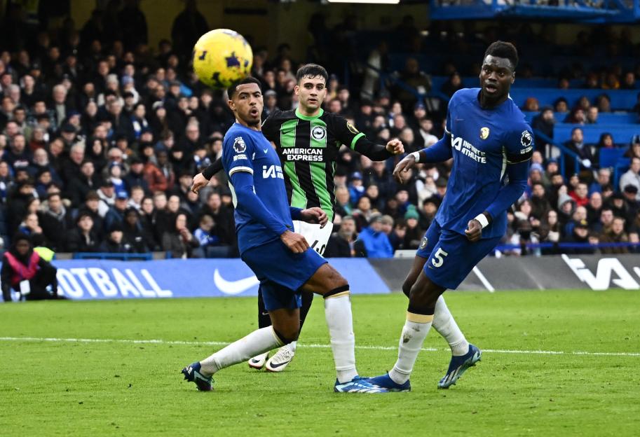 Soccer player scoring a goal.