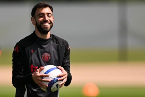 Manchester United's Portuguese midfielder #08 Bruno Fernandes reacts as he takes part in a team training session at the Carrington Training Complex in Manchester, north-west England on May 14, 2025 during a media day ahead of their UEFA Europa League final against Tottenham Hotspur. The UEFA Europa League final will take place on May 21 in Bilbao. (Photo by Oli SCARFF / AFP) (Photo by OLI SCARFF/AFP via Getty Images)