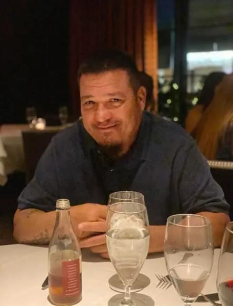 Photo of Ronald Andrew Baquera Jr. at a restaurant.