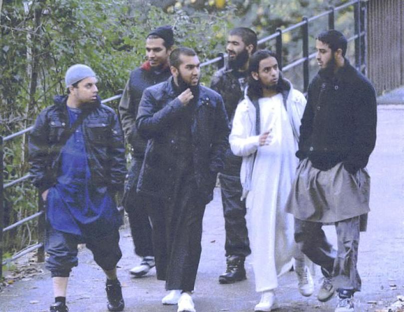 Group of men walking outdoors.