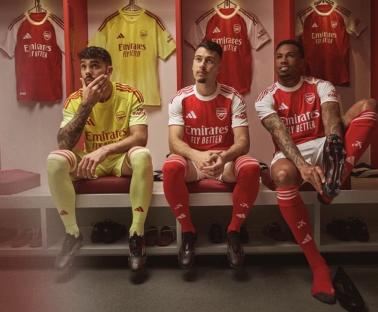 Arsenal players in new home kits.