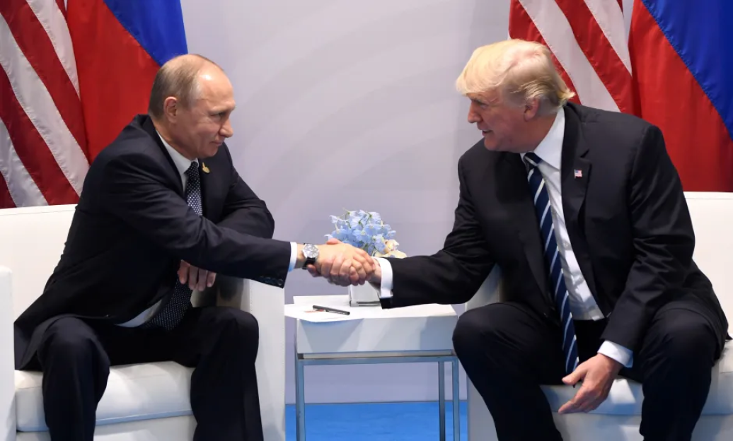 Putin and Trump shaking hands.