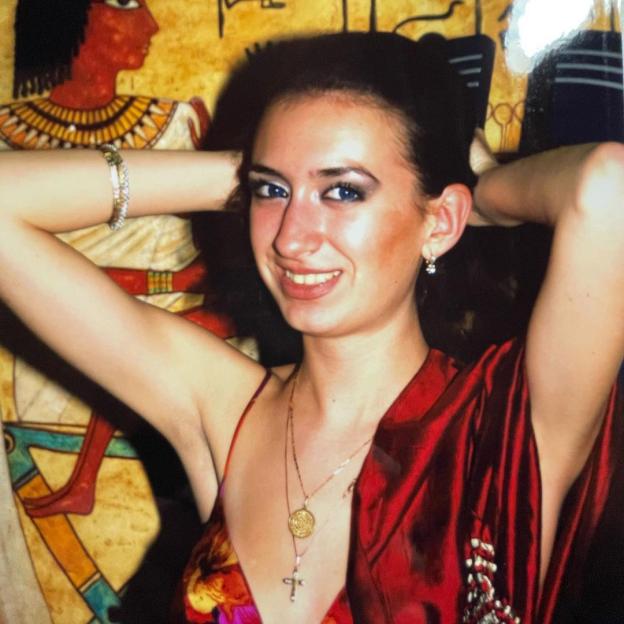 Anastasia Pokreshchuk at 18 years old, smiling, with her hands behind her head.