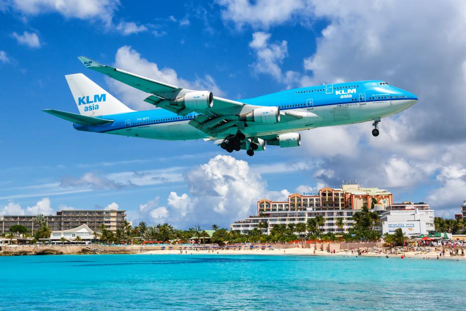 KLM Boeing 747-400 landing over Sint Maarten beach.