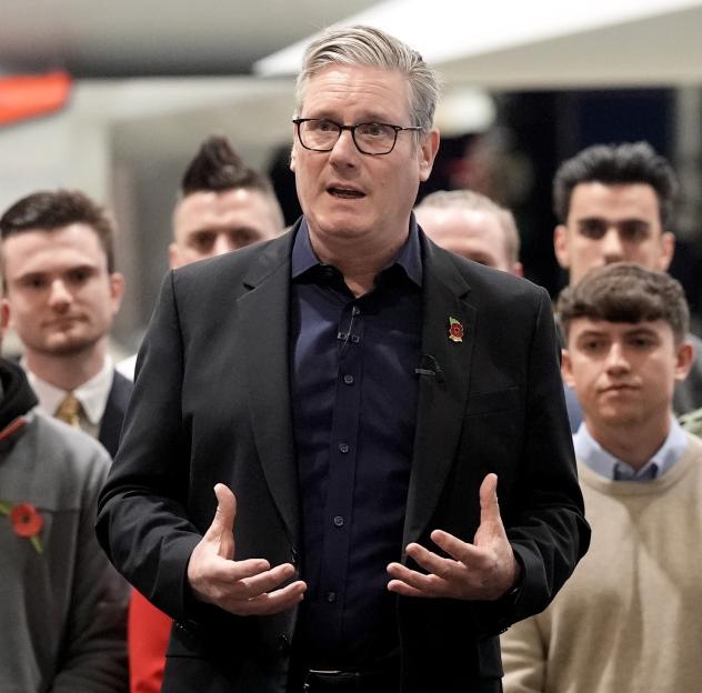 Keir Starmer speaking to workers in front of a fighter jet at BAE Systems.