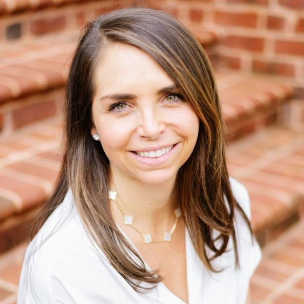 Headshot of a woman smiling.