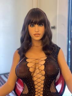 Sex doll wearing a black lace bodysuit.