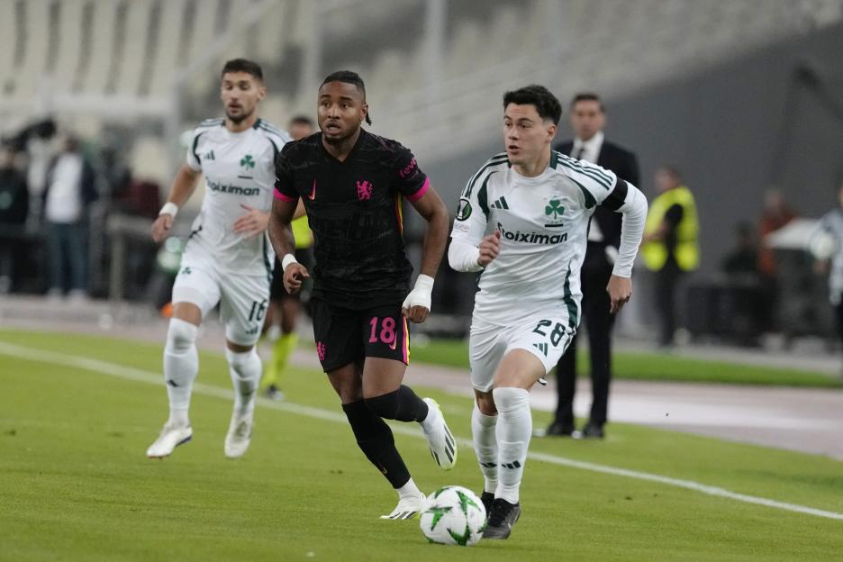 Chelsea's Christopher Nkunku vying for the ball during a soccer match.