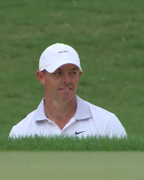 Rory McIlroy on a golf course.