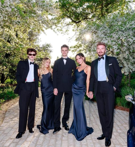David and Victoria Beckham with their children at a birthday celebration.