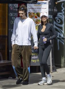 Cruz Beckham and his girlfriend Jackie Apostel holding hands while shopping.