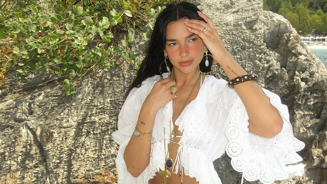 Golden girl of British pop Dua Lipa stuns as she soaks up rays in white two-piece bikini