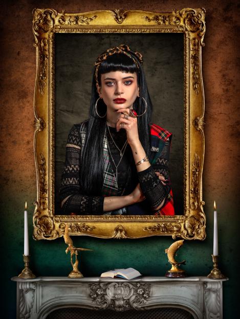 Ruth Codd, a contestant on The Celebrity Traitors, is pictured in a gilded frame above a fireplace.