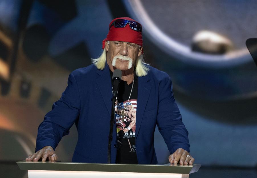 Hulk Hogan speaking at a podium.