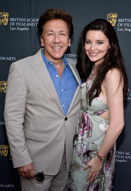 TV Host Ross King and Brianna Deutsch smiling in front of a BAFTA LA backdrop.