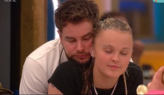 Chris Hughes embracing JoJo Siwa.